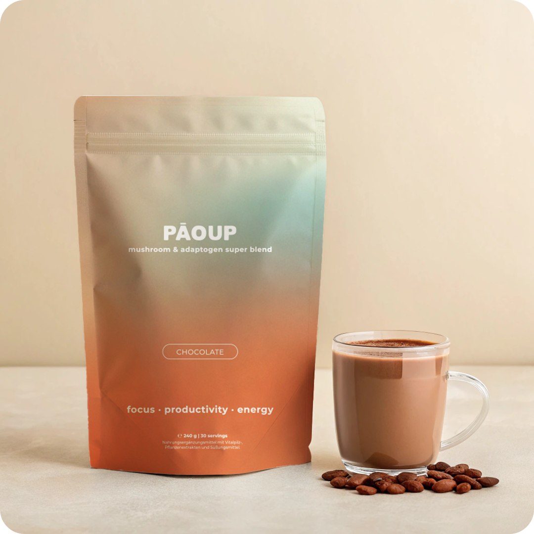 PAOUP chocolate super blend package with a cup of coffee and beans on a beige background