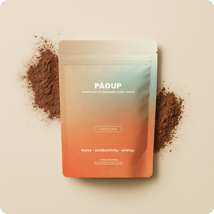 PAOUP chocolate super blend package with cocoa powder on a beige background